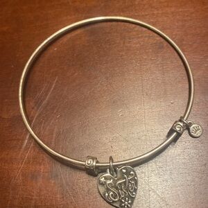 Sister silver tone heart wire bangle bracelet. Adjusts wider to get it on wrist